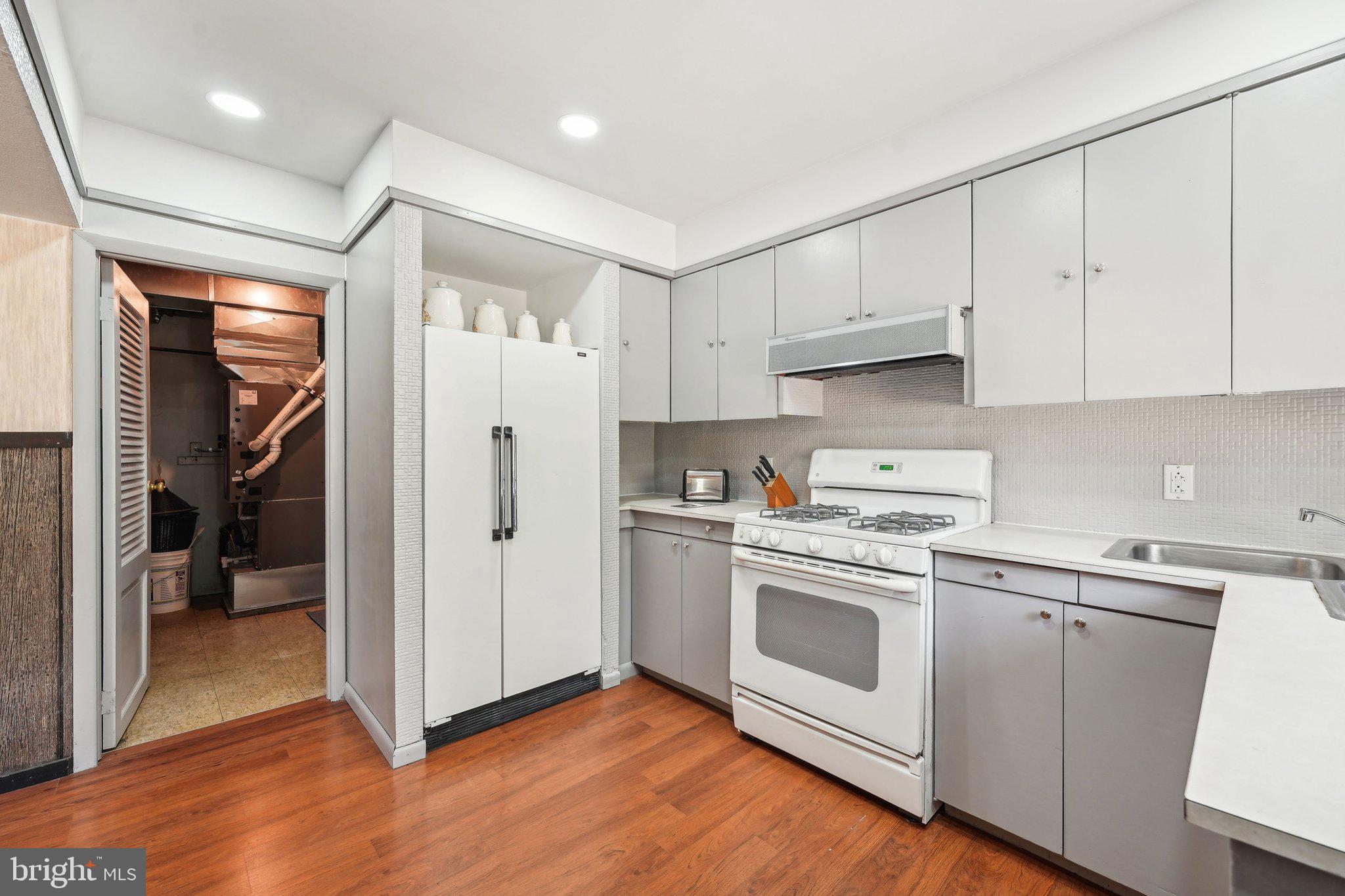 2 Oakview Drive Berlin, NJ 08009 - Photo 19 of 64 a kitchen with white cabinets and white appliances