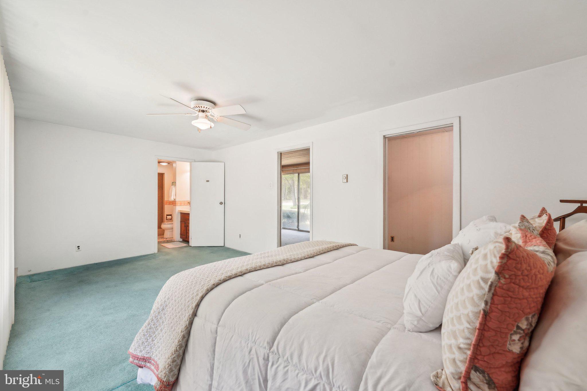 2 Oakview Drive Berlin, NJ 08009 - Photo 23 of 64 a bedroom with a large bed and a ceiling fan