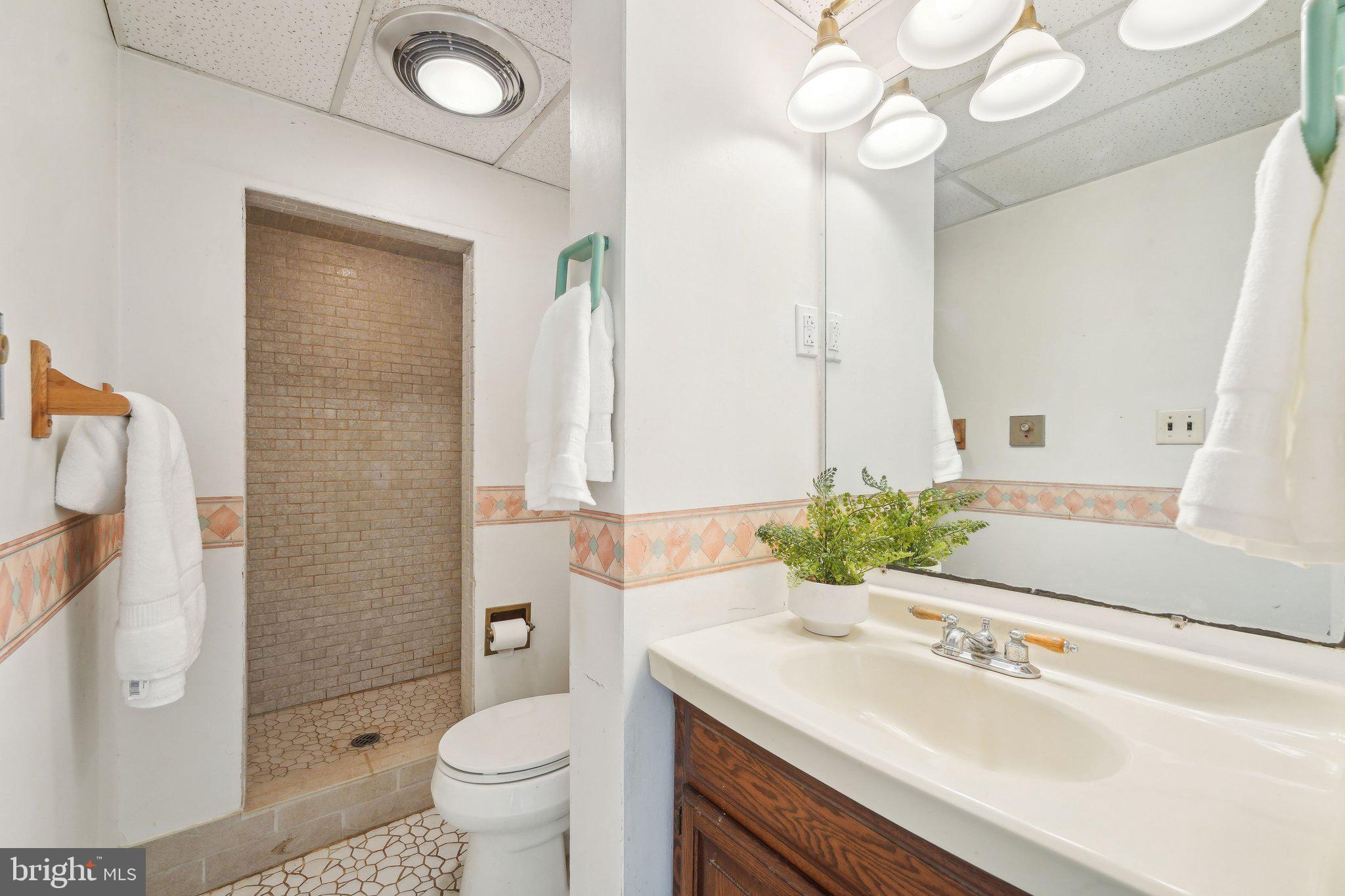 2 Oakview Drive Berlin, NJ 08009 - Photo 25 of 64 a bathroom with a sink vanity mirror and toilet