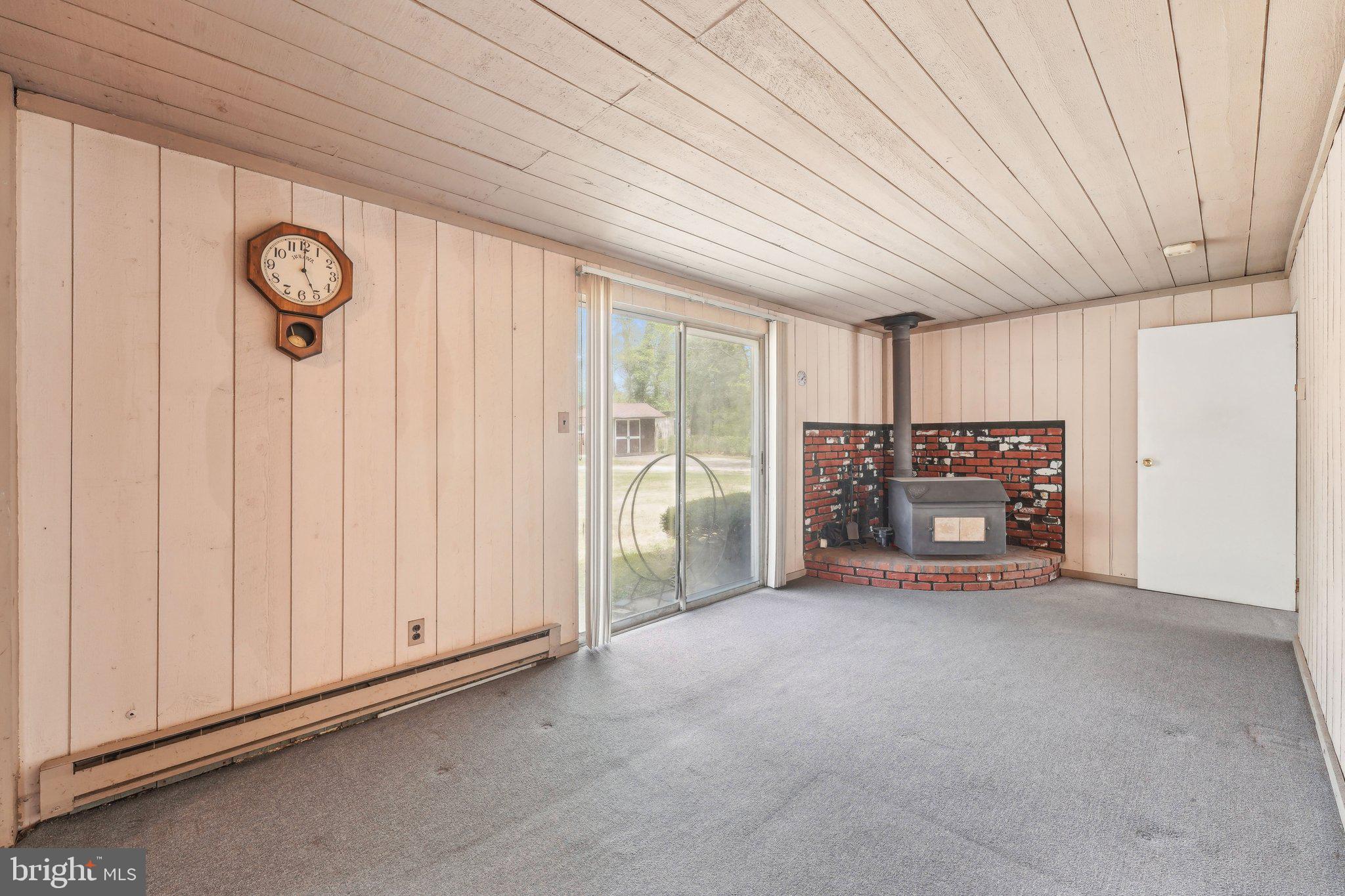 2 Oakview Drive Berlin, NJ 08009 - Photo 8 of 64 a view of an empty room with a fireplace and a window