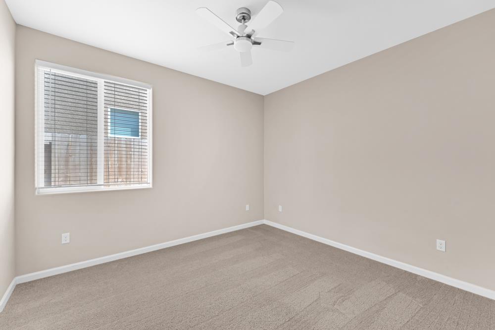 542 Legado Drive Soledad, CA 93960 - Photo 16 of 28 an empty room with a window and a ceiling fan