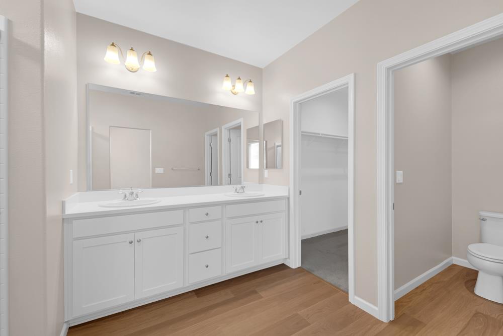 542 Legado Drive Soledad, CA 93960 - Photo 22 of 28 a spacious bathroom with a double vanity sink and a mirror