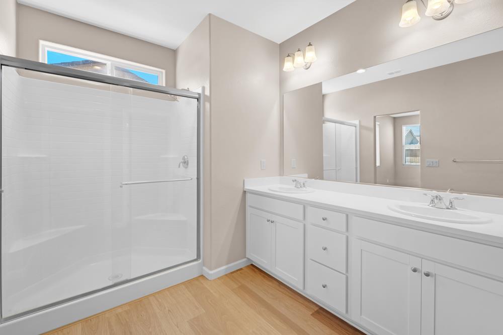 542 Legado Drive Soledad, CA 93960 - Photo 23 of 28 a spacious bathroom with a double vanity sink and a mirror