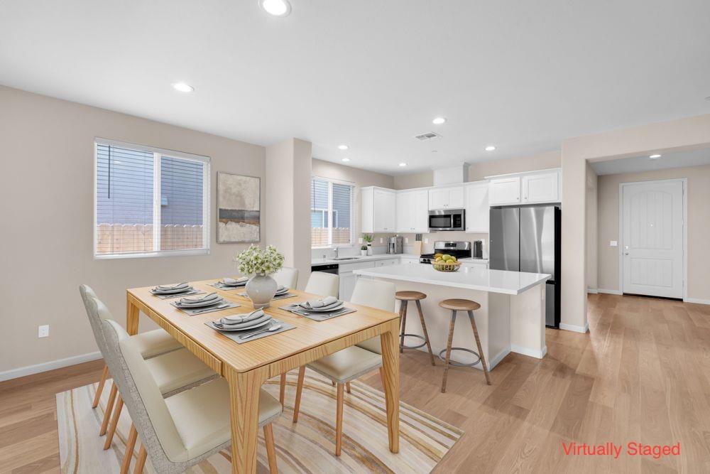 542 Legado Drive Soledad, CA 93960 - Photo 5 of 28 a kitchen with a dining table chairs and refrigerator