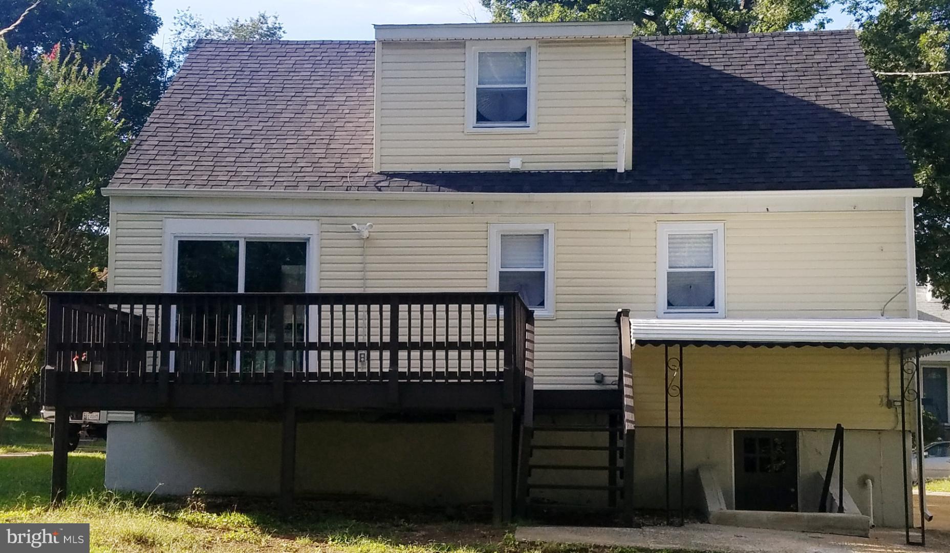 3613 Forest Hill Road Baltimore, MD 21207 - Photo 26 of 27 a front view of a house with garage