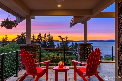 a view of a chairs and table in patio