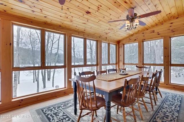 a bathroom with a granite countertop sink and a shower curtain