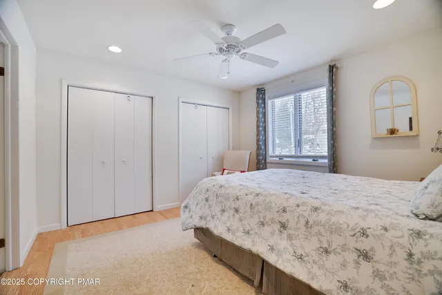a bathroom with double sink and a mirror