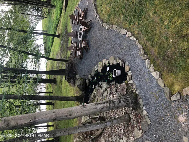 a view of a hallway with paintings on the wall