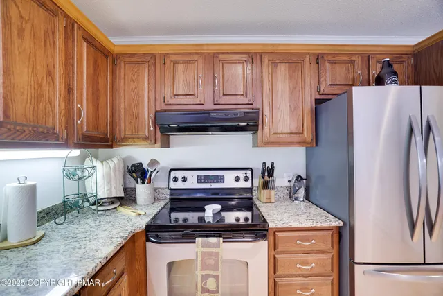 a view of a dining room with furniture large windows and wooden floor
