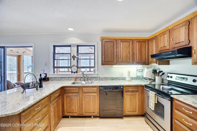 a view of a dining room with furniture wooden floor and chandelier