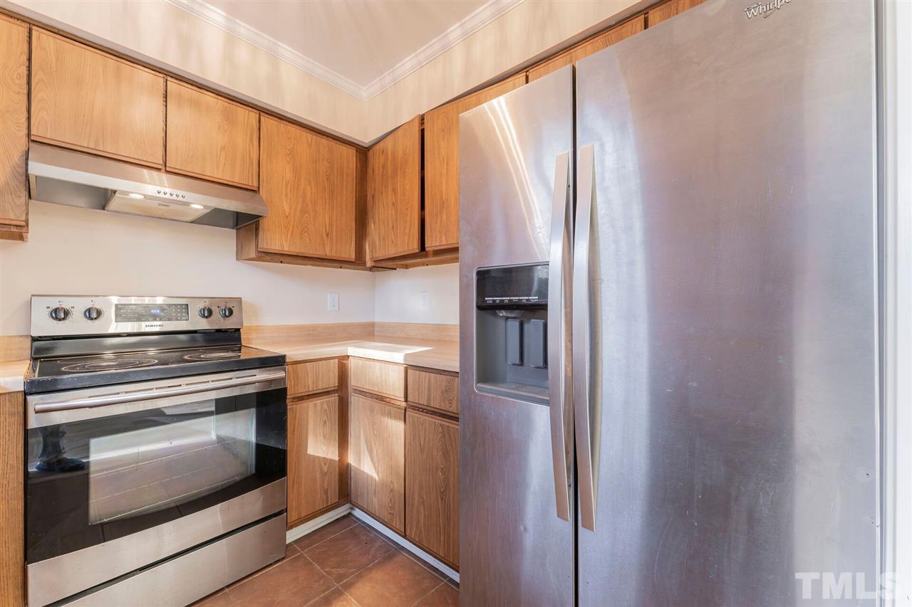 5629 Hamstead Crossing Raleigh, NC 27612 - Photo 11 of 27 a kitchen with appliances cabinets and a window