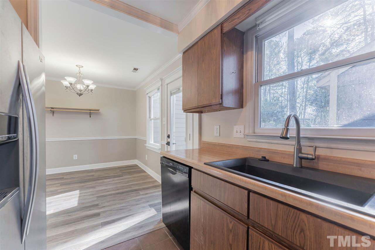 5629 Hamstead Crossing Raleigh, NC 27612 - Photo 12 of 27 a kitchen with a sink and a window