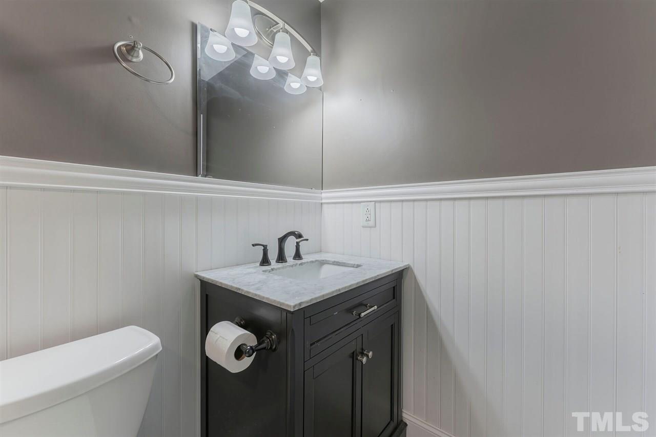 5629 Hamstead Crossing Raleigh, NC 27612 - Photo 17 of 27 a bathroom with a sink vanity and toilet