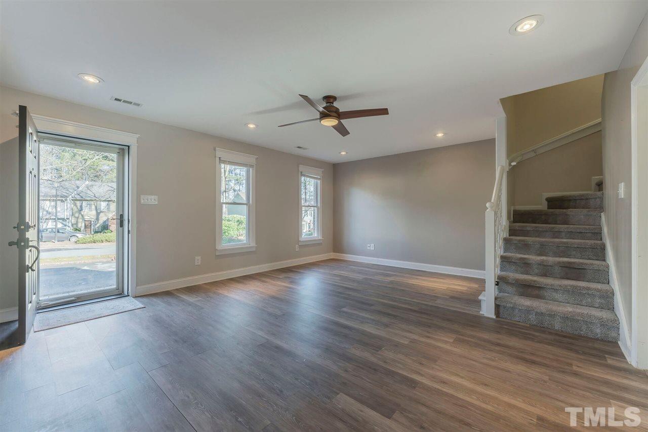 5629 Hamstead Crossing Raleigh, NC 27612 - Photo 3 of 27 wooden floor in an empty room with a window