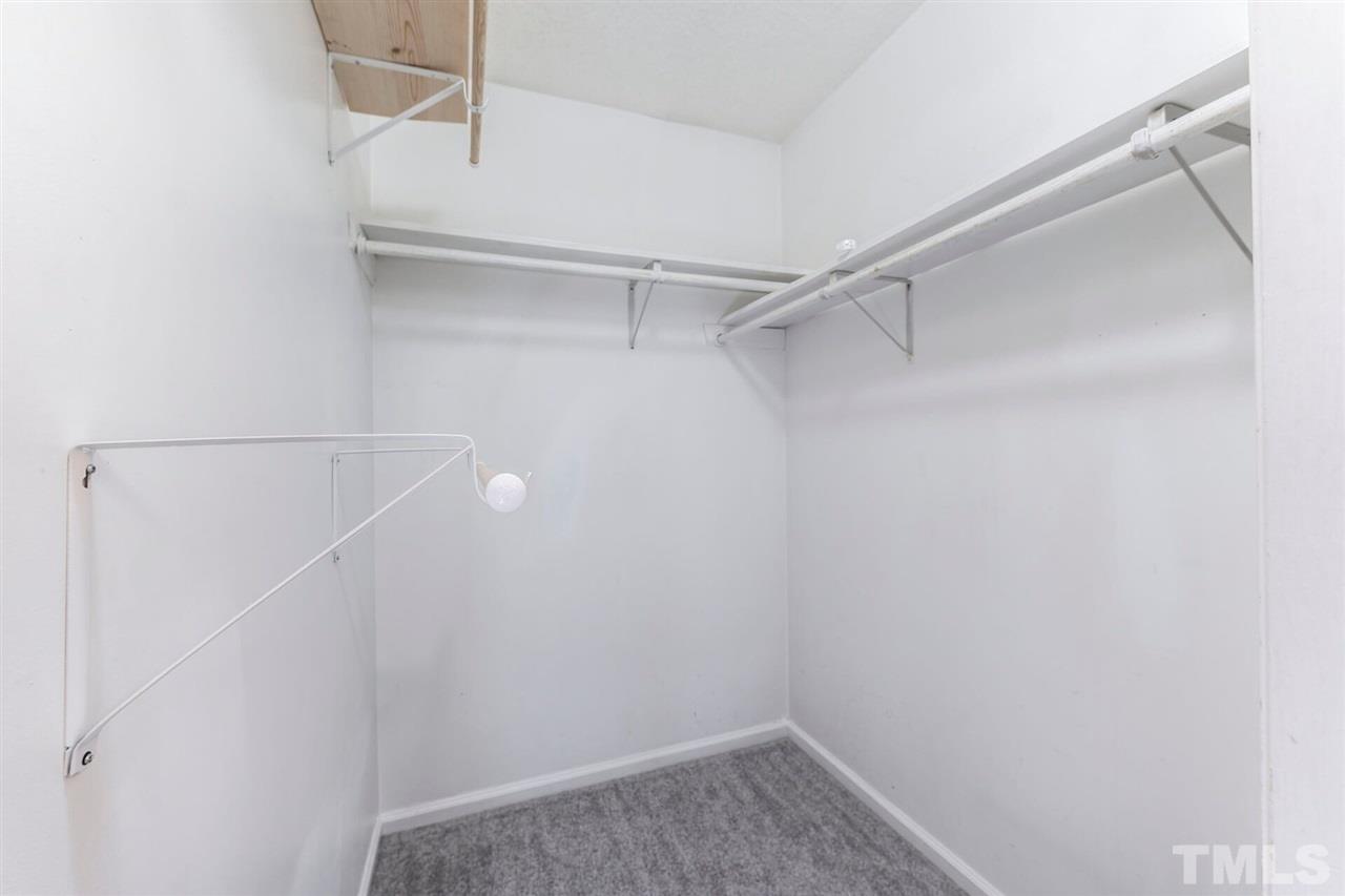 5629 Hamstead Crossing Raleigh, NC 27612 - Photo 22 of 27 a view of an empty walk in closet