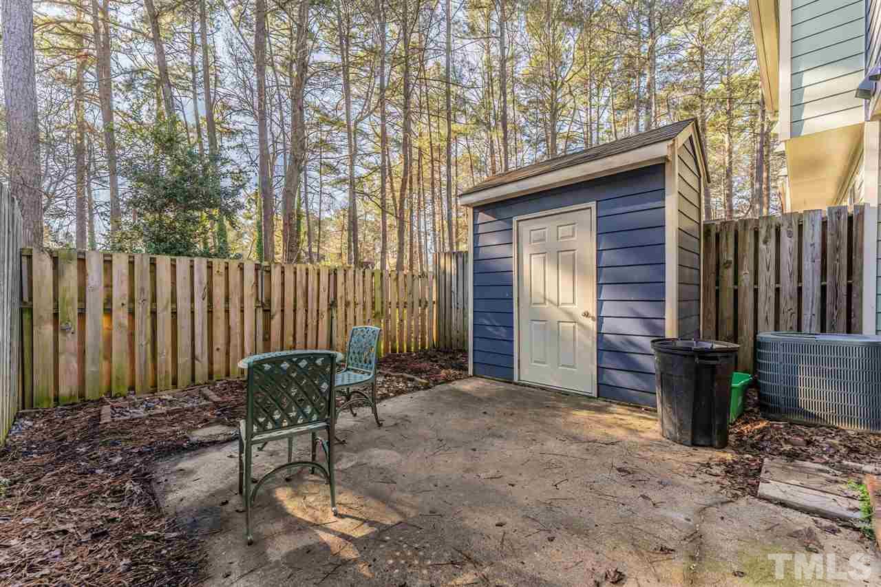 5629 Hamstead Crossing Raleigh, NC 27612 - Photo 25 of 27 a view of a chair and table in backyard