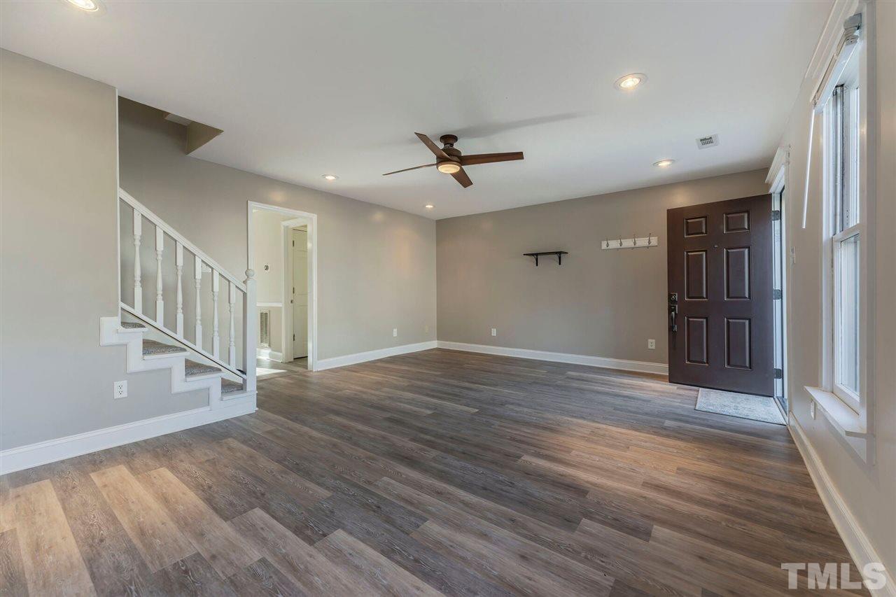 5629 Hamstead Crossing Raleigh, NC 27612 - Photo 5 of 27 wooden floor in an empty room with a window