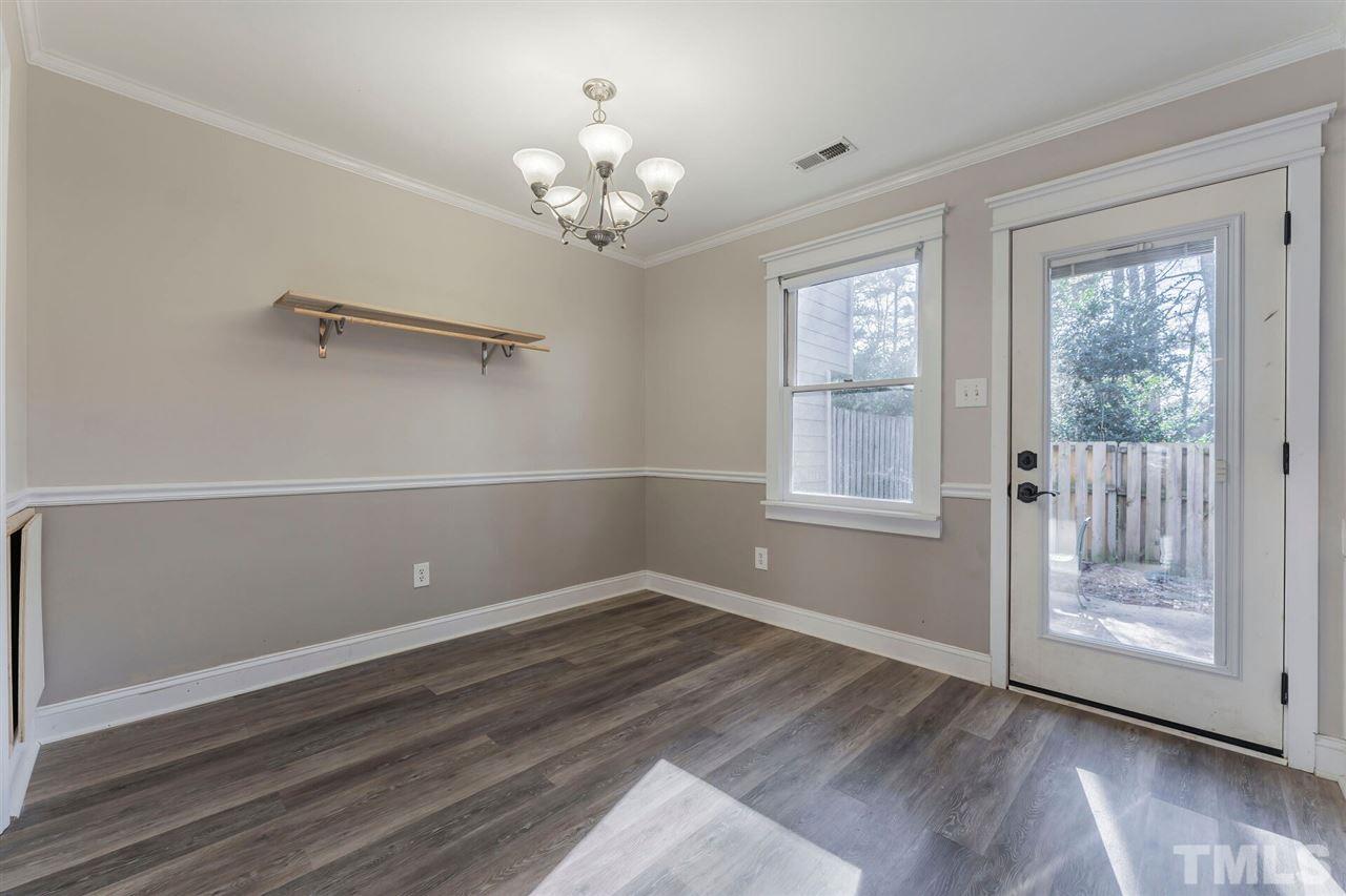 5629 Hamstead Crossing Raleigh, NC 27612 - Photo 7 of 27 wooden floor in an empty room with a window