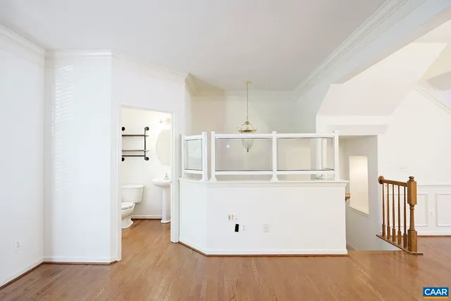 a view of utility room with wooden floor