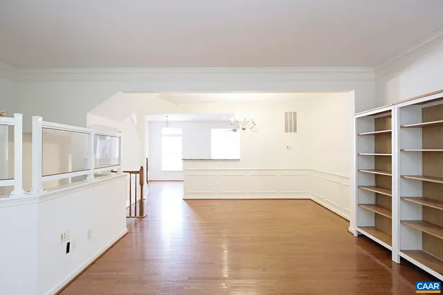 a view of a big room with wooden floor and floors