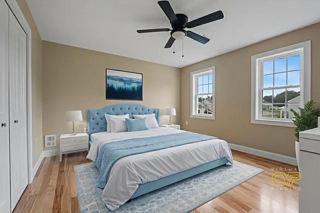 a bedroom with a large bed and a window