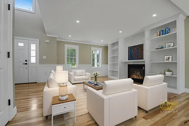 a living room with furniture and a fireplace