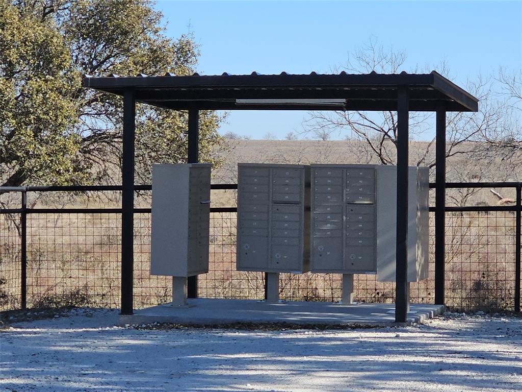 0 Pecan Valley Drive Gustine, TX 76452 - Photo 18 of 19 a view of entrance gate of the house and cars parked