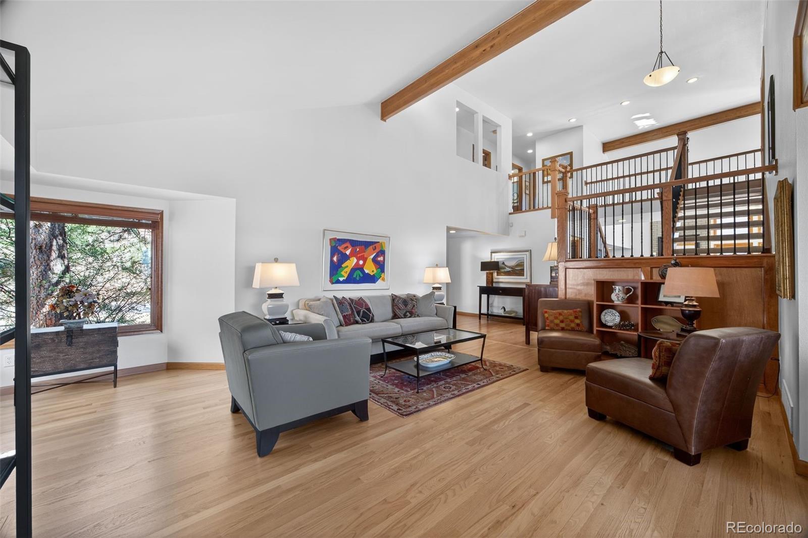 2452 Terraridge Drive Highlands Ranch, CO 80126 - Photo 14 of 50 a living room with furniture and a large window