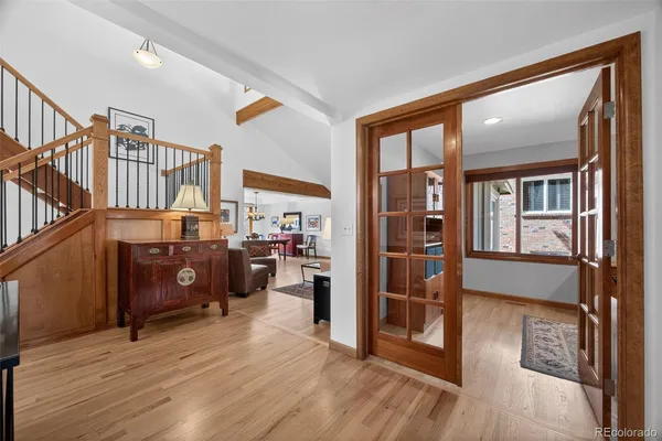 a view of a livingroom with furniture and hardwood floor
