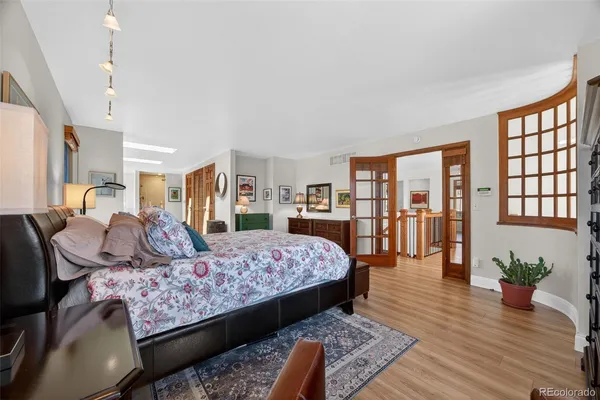 a bedroom with a large bed and a window