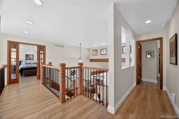 a view of a livingroom with furniture and hardwood floor