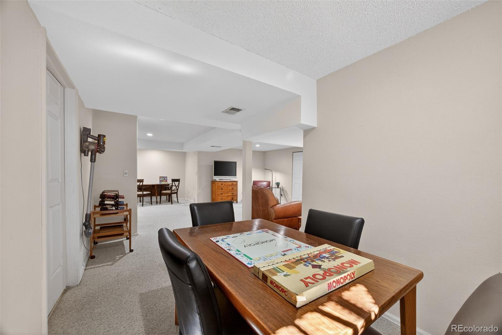 2452 Terraridge Drive Highlands Ranch, CO 80126 - Photo 35 of 50 a living room with furniture and next to a window