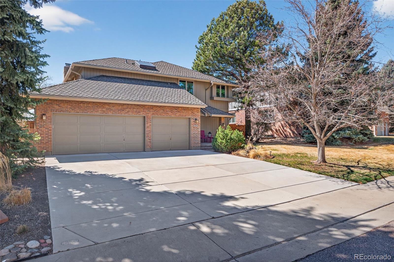 2452 Terraridge Drive Highlands Ranch, CO 80126 - Photo 38 of 50 a front view of a house with a yard and garage