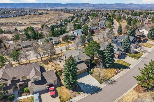 an aerial view of a house with a yard