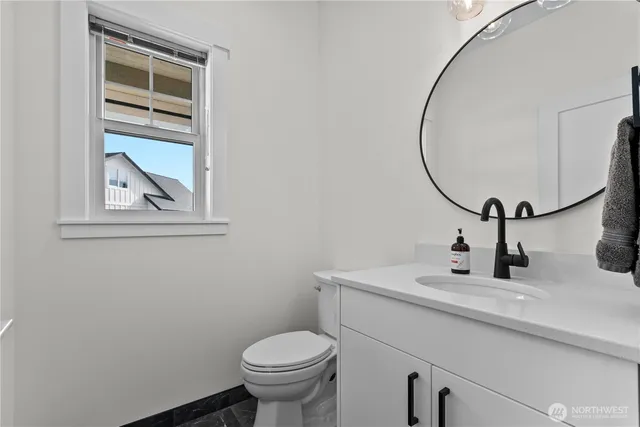 a kitchen with a sink a cabinets and window