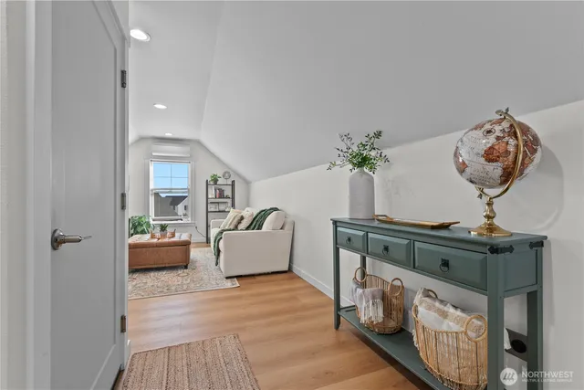 a living room with furniture window and a flat screen tv