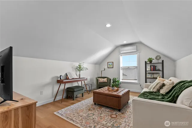 a view of kitchen with furniture and wooden floor