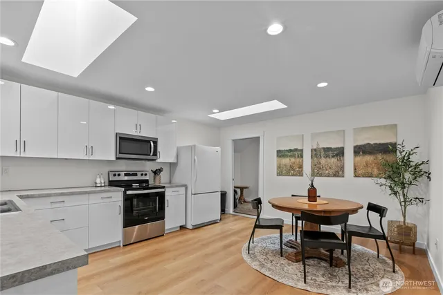 a kitchen with a table and chairs in it