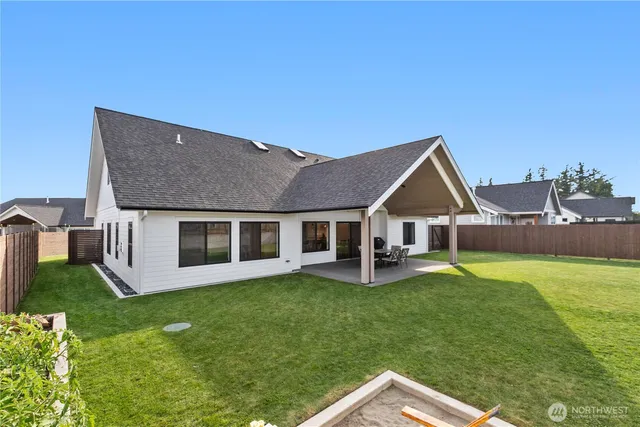 a patio with table and chairs