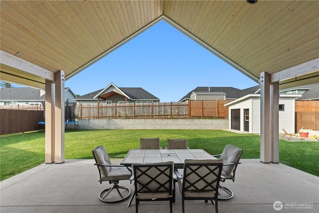 a front view of a house with a garden and garage
