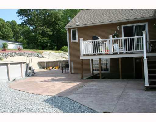 12 Grove Road Cumberland, RI 02864 - Photo 4 of 9 Swimming Pool/Hot Tub/Sauna. Deck, stamped concrete patio and pool off the back of the house