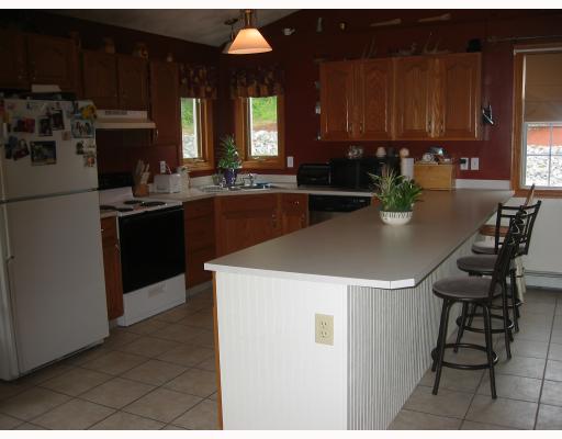 12 Grove Road Cumberland, RI 02864 - Photo 5 of 9 Kitchen. Open kitchen with corner sink overlooking pool/patio
