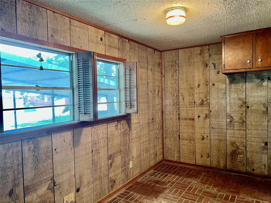 200 Dallas Street Nocona, TX 76255 - Photo 22 of 29 a view of a hallway with wooden floor and entryway