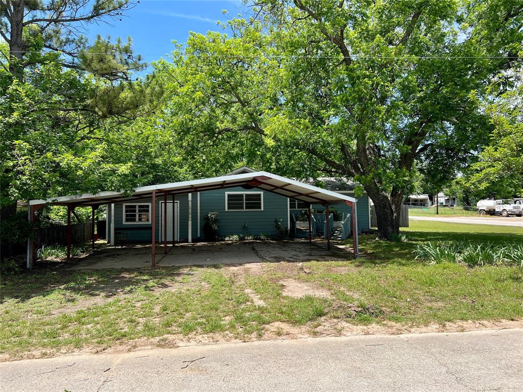 200 Dallas Street Nocona, TX 76255 - Photo 5 of 29 a front view of house with yard seating and green space