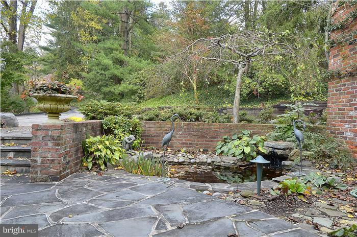 913 Poplar Hill Road Baltimore, MD 21210 - Photo 2 of 21 a garden with lots of trees