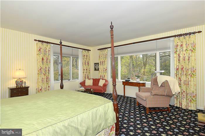 913 Poplar Hill Road Baltimore, MD 21210 - Photo 14 of 21 a bedroom with a bed and a window