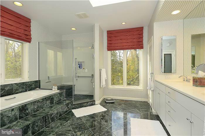 913 Poplar Hill Road Baltimore, MD 21210 - Photo 15 of 21 a spacious bathroom with a granite countertop sink and a mirror