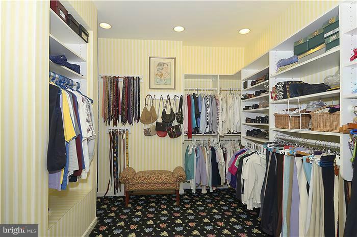 913 Poplar Hill Road Baltimore, MD 21210 - Photo 17 of 21 a view of walk in closet with clothes and shoes
