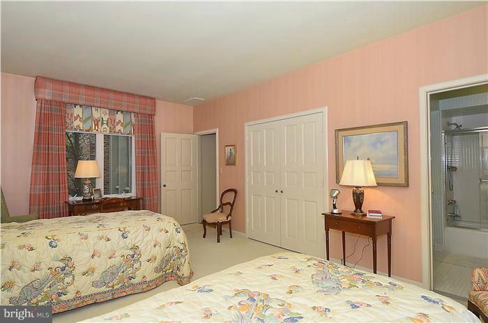 913 Poplar Hill Road Baltimore, MD 21210 - Photo 18 of 21 a bedroom with a bed and wooden floor